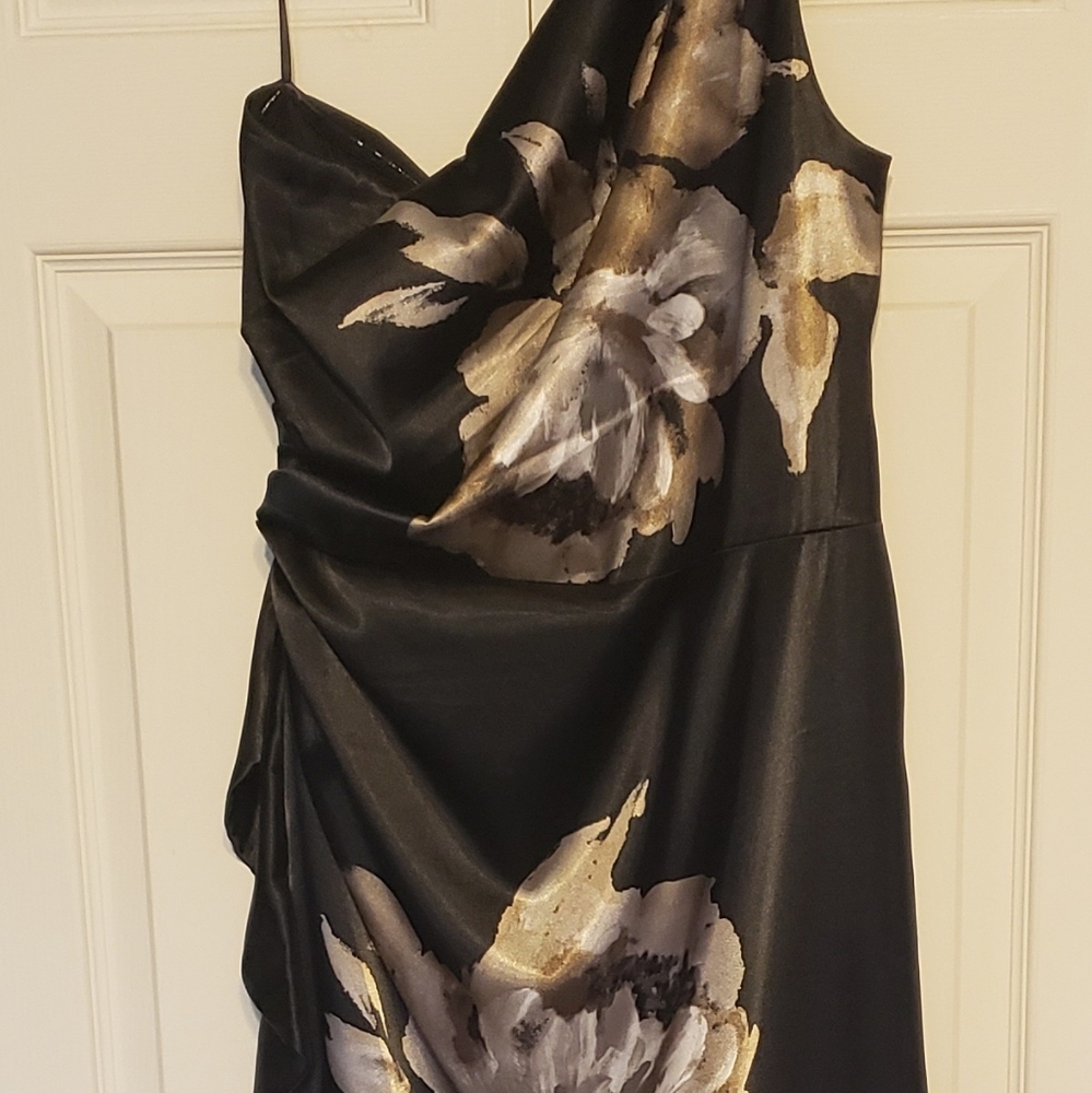 Ladies one shoulder cocktail dress black w/large flower design.